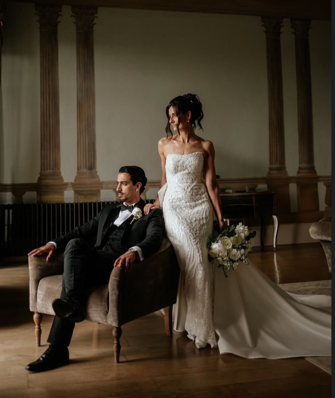 A bride and groom in an elegant wedding portrait